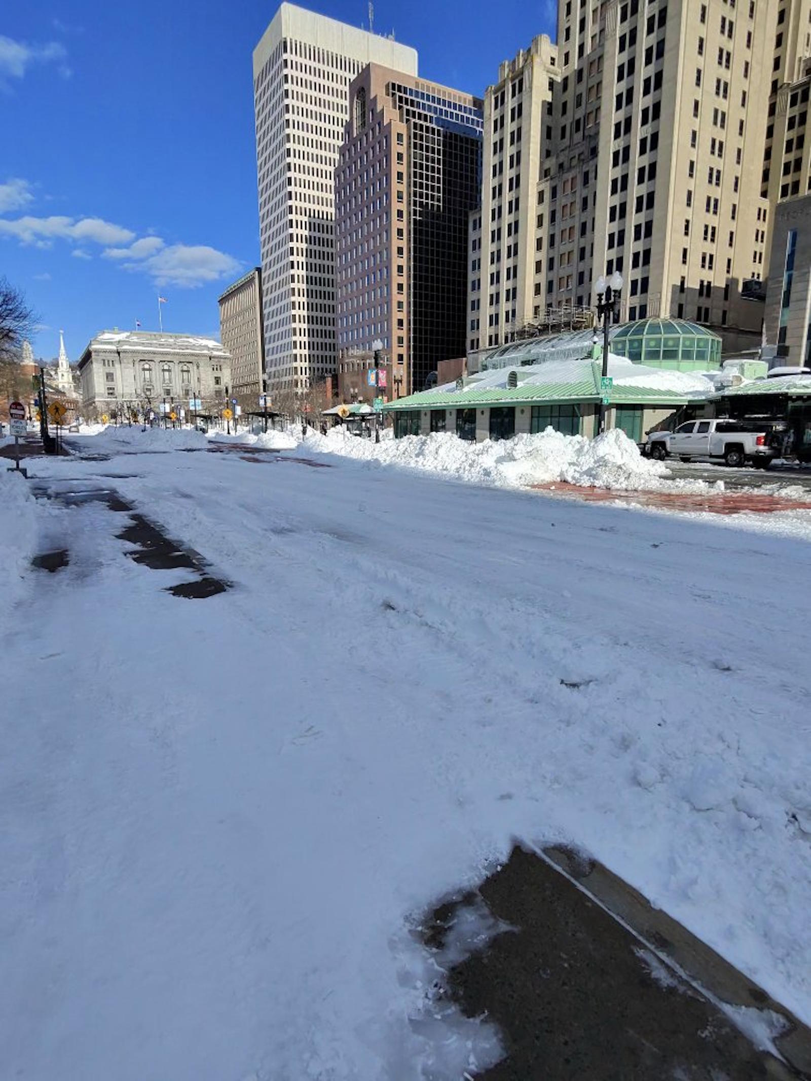 Kennedy Plaza Providence after historic blizzard 2026 - snow-covered plaza with bus station dome and city skyline