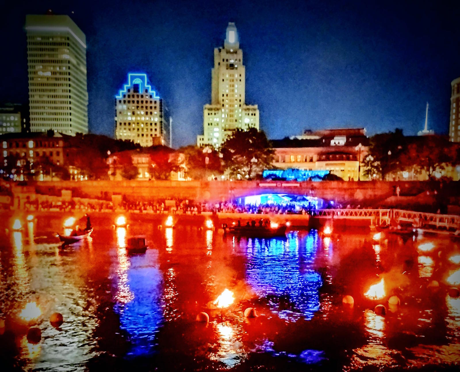 What the River Remembers - Providence WaterFire reflected in water